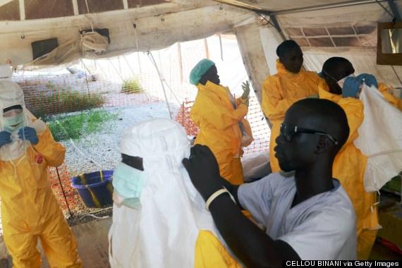 Members of MSF put on protective gear to deal with the Ebola virus. Photo: CELLOU BINANI/AFP/Getty Images